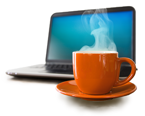 A steaming teacup and saucer in front of a laptop with a blank screen